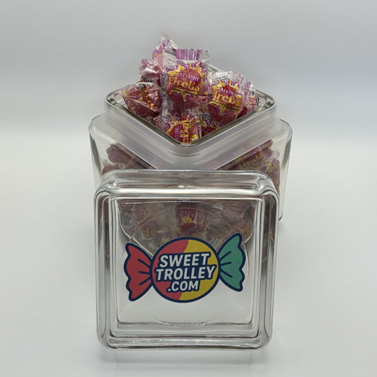 Clear glass jar filled with atomic fireballs and a 'Sweet Trolley' logo on a white background
